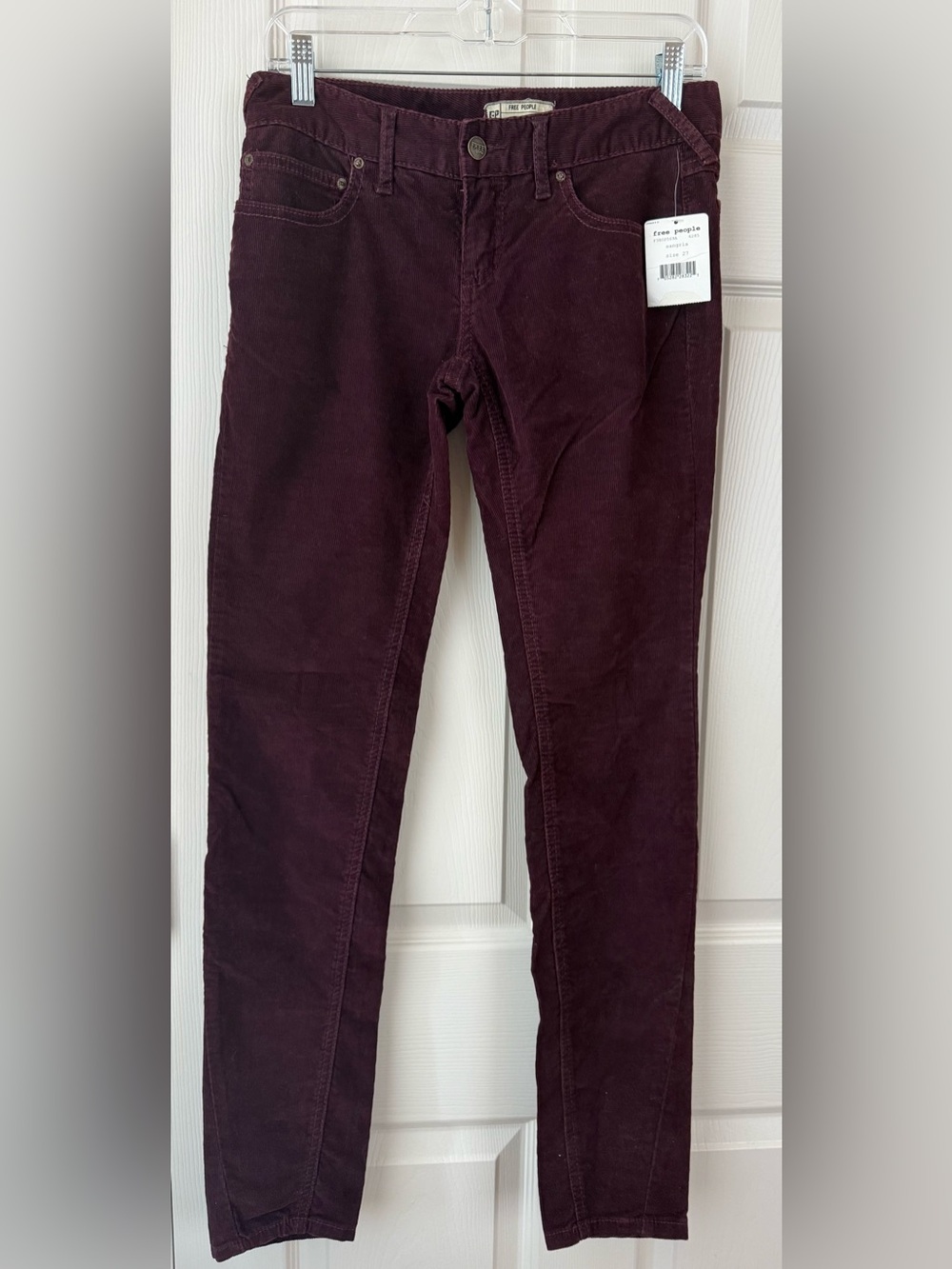 Free People skinny corduroy pants in the colorway "Sangria"